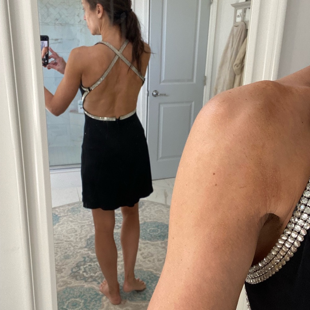 Black cocktail dress with rhinestone detail
